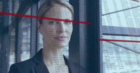 Businesswoman Studying Numeric Columns on Glass with Red Trend Lines