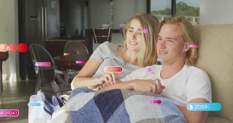 Couple engaging virtual entertainment with digital overlay