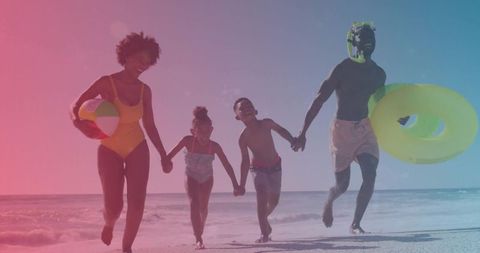 Happy Family Enjoying Day at the Sunny Beach