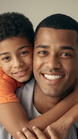 Father and Son Reuniting, Hugging Close-Up with Warm Smiles — Vertical Video