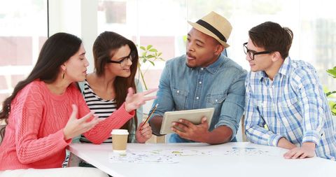 Diverse Team Collaborating Around Office Table