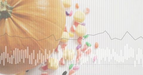 Autumn pumpkin with scattered colorful candies and subtle data graph overlay for seasonal stats