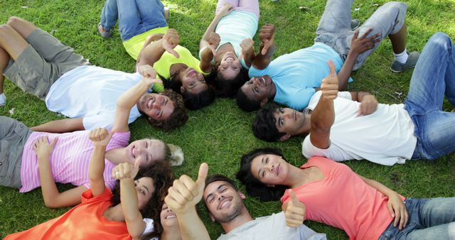 Diverse Group of Friends Lying on Grass with Thumbs Up - Download Free Stock Images Pikwizard.com