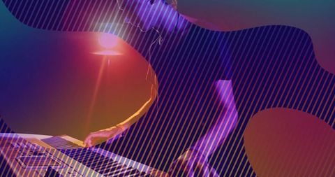 Musician Performing with Electronic Keyboard Under Vibrant Lights