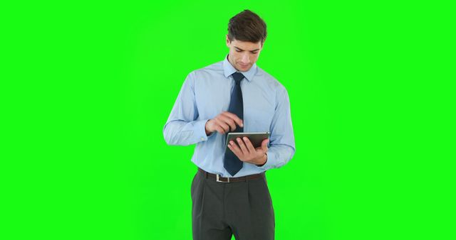 Young Professional Using Tablet with Green Screen Background - Download Free Stock Images Pikwizard.com