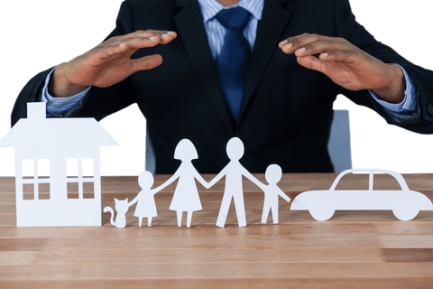 Businessman demonstrating insurance protection with transparent family cutouts