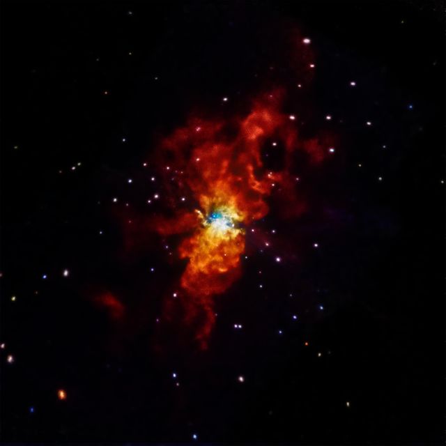 Capturing the mesmerizing beauty of a nebula with vivid reds and whites highlighting star formation. Ideal for educational content on astronomy, presentations on space exploration, and inspiring backgrounds for digital projects.