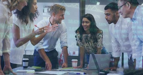 Diverse Colleagues Analyzing Financial Data in Team Meeting