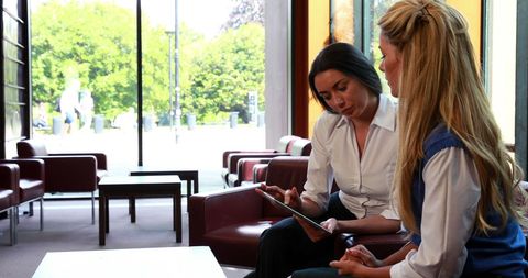 Businesswomen Collaborating in Office with Tablet - Download Free Stock Images Pikwizard.com