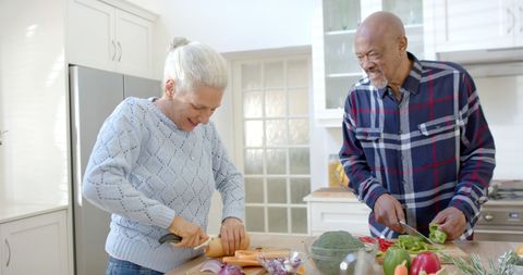 Happy Senior Couple Preparing Vegetables in Kitchen - Download Free Stock Images Pikwizard.com