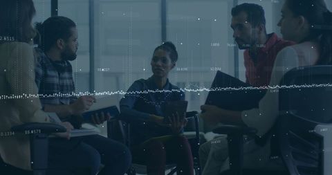 Team meeting with digital financial data overlay