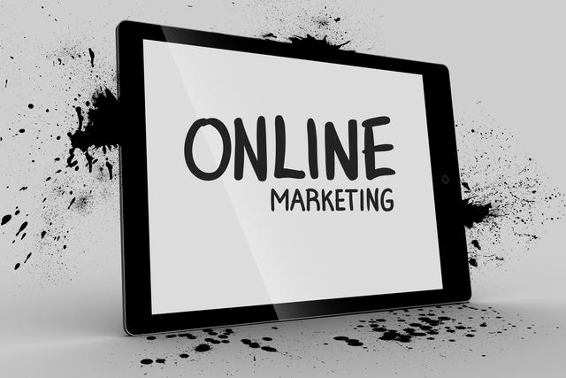 Tablet displaying 'Online Marketing' message with ink splatter background. Ideal for use in digital marketing campaigns, business presentations, advertising materials, and e-commerce websites.