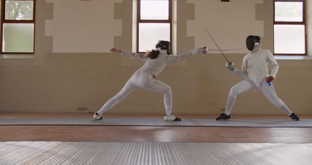 Two Athletes Fencing in Training Hall - Download Free Stock Images Pikwizard.com