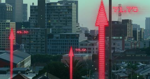 Rising Financial Indicators Over City Skyline