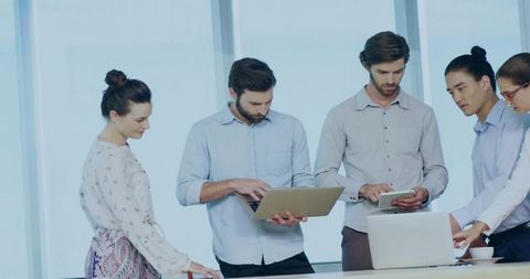 Team of Professionals Collaborating in Modern Office with Technology