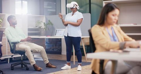 Businesswoman Engaging with Virtual Reality in Active Office Environment