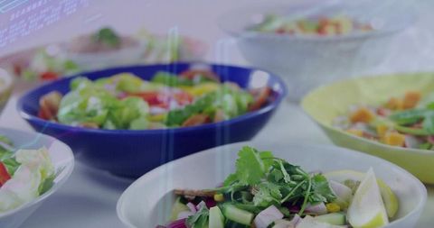 Fresh Salads in Ceramic Bowls with Holographic Interface