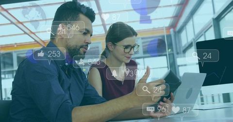 Team Analyzing Social Media Engagement Metrics in Modern Office