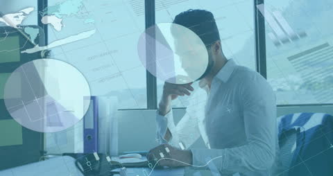 Businessman Analyzing Global Financial Data in Modern Office