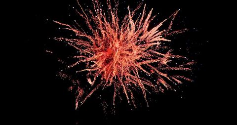 Vibrant Red Fireworks Display Against Night Sky