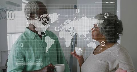 Mature couple discussing global data with translucent world map hud overlay in kitchen