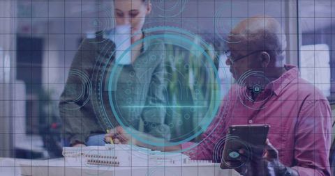 Office professionals collaborating on scale model with digital overlay