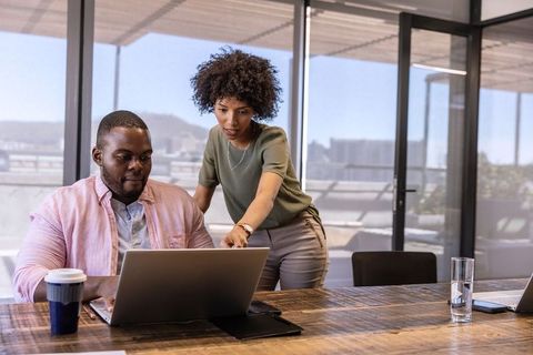 Collaborative Teamwork in Modern Glass-Walled Office