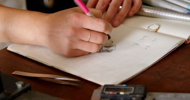 Close-up of Person Writing and Drawing in Notebook - Download Free Stock Images Pikwizard.com