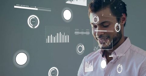 Professional analyzing data on digital interface with futuristic graphics