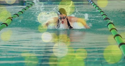 Energetic Swimmer Performing Butterfly Stroke in Pool Lane