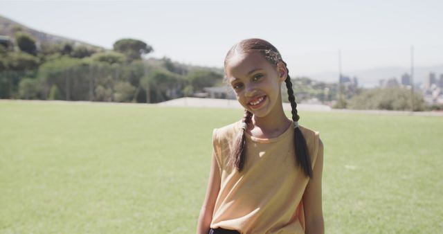 Smiling Girl with Braided Hair in Park on Sunny Day - Download Free Stock Images Pikwizard.com