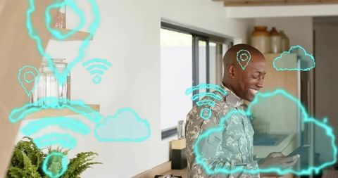 Smiling soldier checking smartphone in smart home, viewing cyan cloud and IoT holograms