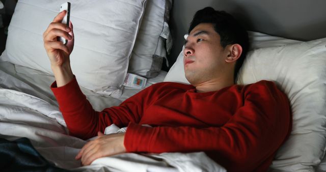 Young Man Texting on Smartphone in Bed at Night - Download Free Stock Images Pikwizard.com