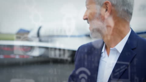 Businessman at Airport with Digital Technology Overlay
