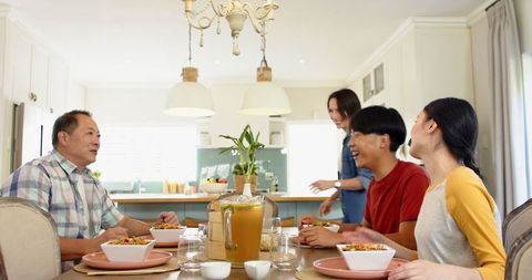 Happy Family Enjoying Lunch Together in Bright Kitchen