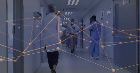 Medical staff walking hospital corridor wearing masks with digital network overlay