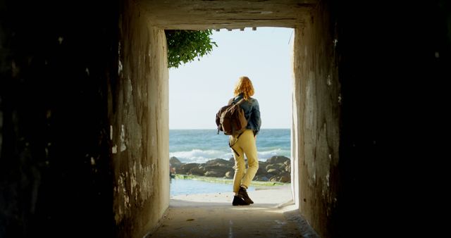 Woman Standing in Tunnel Overlooking Ocean - Download Free Stock Images Pikwizard.com