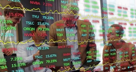 Financial team analyzing live stock market data on laptop with dynamic ticker overlays