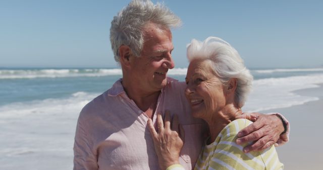 Senior Couple Embracing and Smiling at Beach - Download Free Stock Images Pikwizard.com