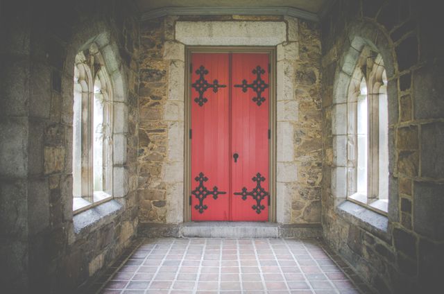 Historic Red Door in Stone Building Corridor - Download Free Stock Photos Pikwizard.com