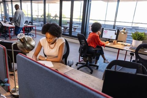 Professional Team Working Collaboratively in Modern Open-Plan Office