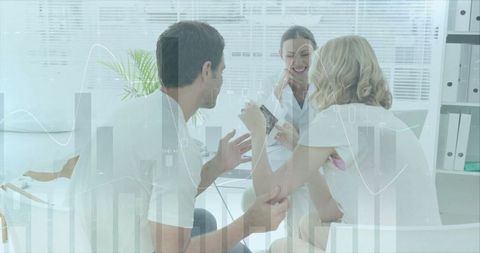 Doctor Explaining Ultrasound to Expecting Couple in Medical Office