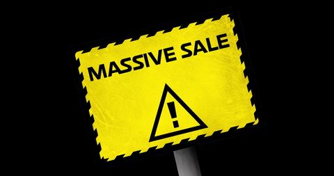 Massive sale alert sign against black background