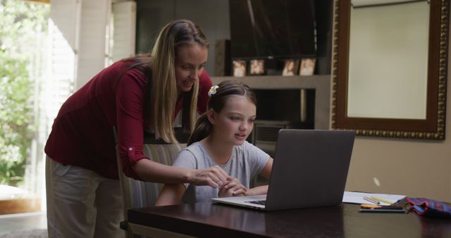 Caucasian Mother Helping Daughter Learn Online at Home Together - Download Free Stock Images Pikwizard.com