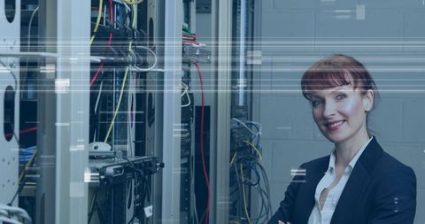 Confident Woman IT Professional Standing by Server Racks - Download Free Stock Images Pikwizard.com