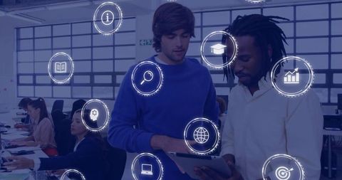 Collaborating on tablet with floating ui icons in modern coworking office with diverse team