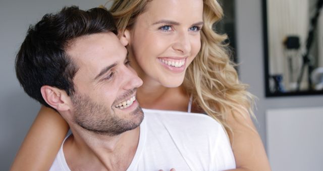 Happy couple smiling while embracing at home - Download Free Stock Images Pikwizard.com