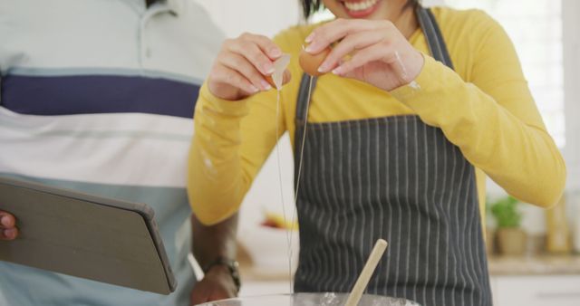 Couple Baking Together and Cracking Egg into Mixing Bowl - Download Free Stock Images Pikwizard.com