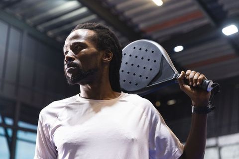 African American Athlete Holding Padel Racket in Gym