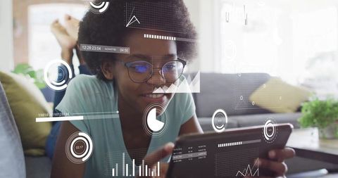 Young Woman Conducting Data Analysis on Tablet in Home Environment
